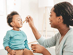 Women Feeding Baby