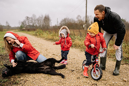 Family on path with dog